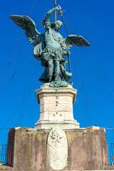 Fototapeta na wymiar one of the statues on the bridge of sant angelo towards the castle of the same name