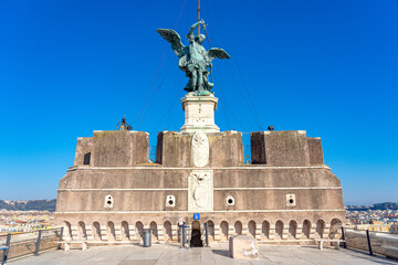 one of the statues on the bridge of sant angelo towards the castle of the same name