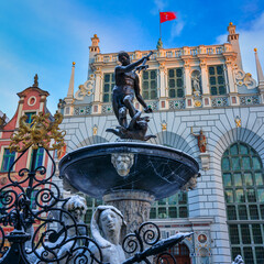 Gdansk, Poland - November 26, 2023: Sunrise in the historic center of Gdansk at the Neptune...