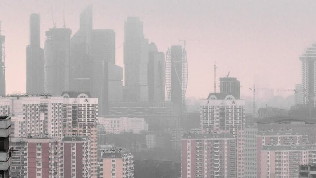 Skyscrapers of Moscow's International Business Center City on a Foggy Winter Day Before Sunset Timelapse from Above. Awe-inspiring skyline of Moscow's City enveloped in fog on a winter afternoon
