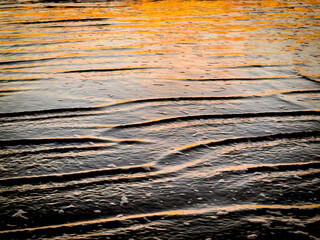 sunlight reflecting on rippled water