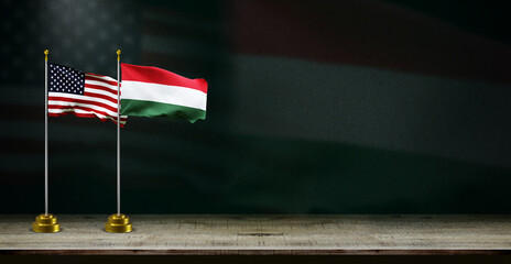 hungary and USA or america flag wave on dark background. digital illustration for national activity or social media content.