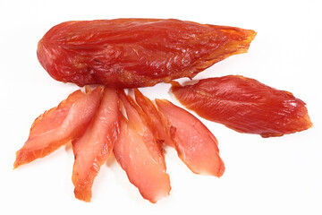 Smoked chicken breast. White background. Dietary meat. Meat cut into slices. Flat lay. Top view. Copy space. Isolated object.