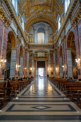 rear nave facing the doorway inside the basilica SS Ambrogio e Carlo in the center of the italian...