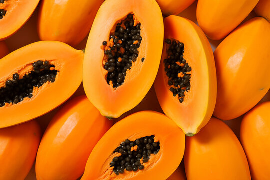Fresh open papaya background arranged together representing healthy diet concept