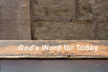 God's word for today written on a piece of wood, plenty of copy space around for more text.