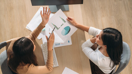 Top view of Team business woman using laptop while plan and discussion information for financial in home office. Beautiful woman happy and working at indoors.