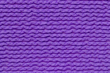 Pink fabric texture. Close-up of an elastic blue nylon fabric with seamless pattern for sports equipment, backpacks, bags or other garments. Macro.
