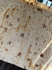 Closeup of a flatbread on a panini press