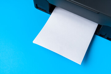Modern printer with paper on blue background