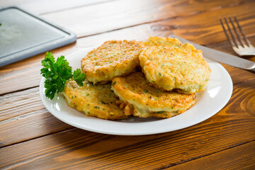 cooked fried potato cutlets with herbs