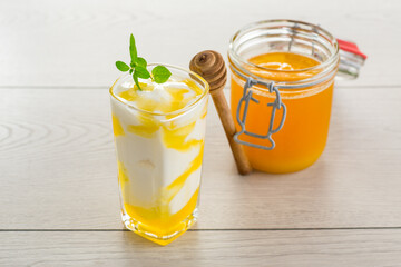 prepared homemade yogurt with natural honey in a glass