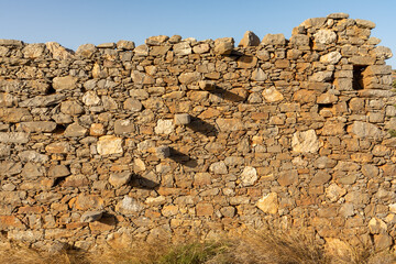 The impressive ruins of the Vrouhas windmills on a beautiful sunny day.  Crete, Greece.