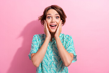 Portrait of positive impressed girl arms touch cheekbones open mouth cant believe isolated on pink color background - obrazy, fototapety, plakaty