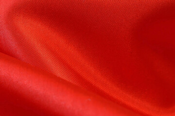 Red fabric texture, silk background, surface, closeup