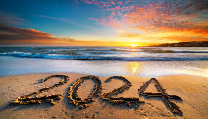 New year, 2024 written in sand on a beach during soft sunset. - obrazy, fototapety, plakaty