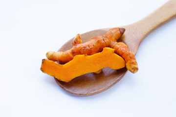 Turmeric roots on white background.