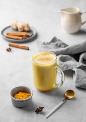 Turmeric golden milk latte with spices and honey. Detox, immunity boosting, anti-inflammatory, healthy, cozy drink