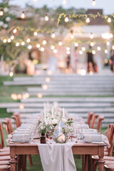 lovely Table setting for magnificent composition from flowers at a wedding , Centerpiece white and orange color palette flower bouquet arrangement