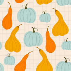 different pumpkins on a checkered background. seamless background with blue and orange pumpkins