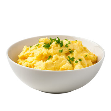 Creamy scrambled eggs garnished with chives on a white dish.