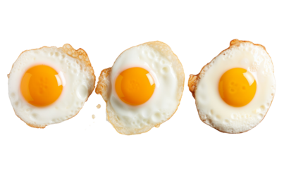 Three fried eggs on a transparent background.