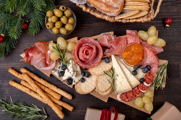 Charcuterie board italian food antipasti prosciutto ham, salami and cheese appetizers served in the...