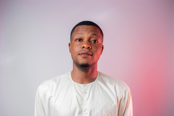 Obraz premium Portrait of a man wearing a white Jalamia looks into the camera with a bright look of enthusiasm