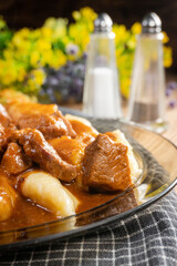 Beef stew in gravy, served with potato dumplings.