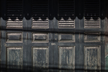 Time-Worn Elegance, Antique Black Wooden Window Shutters.