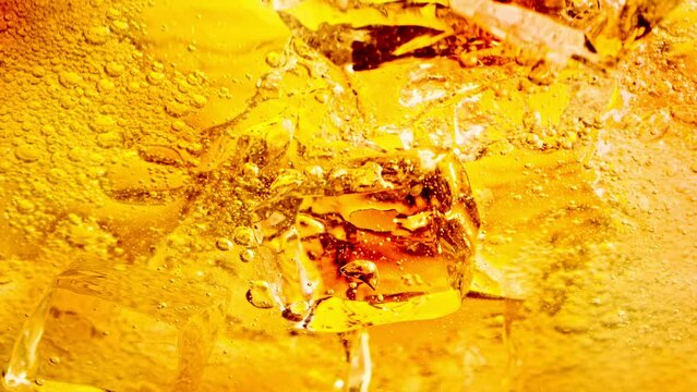 Super Slow Motion Shot of Ice Cubes Falling into Lemonade at 1000fps.
