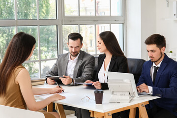 Human resources commission interviewing female applicant in office