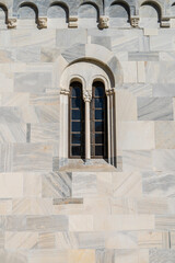 Fototapeta na wymiar Close-up decorated small monastery window of monastery Studenica