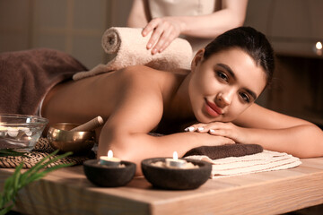 Beautiful woman receiving spa massage in salon - Powered by Adobe