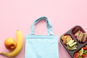 Bag, lunchbox with delicious food and fruits on pink background - Powered by Adobe