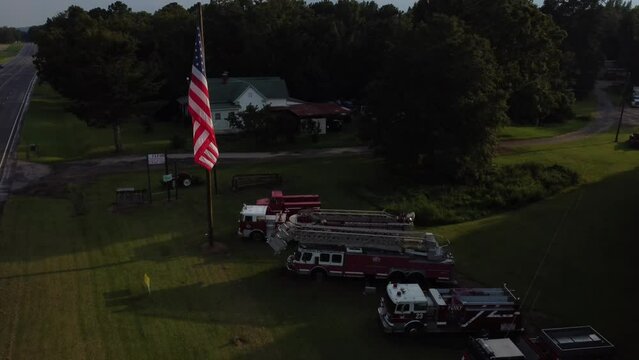 Drone view of American flag flying in the wind