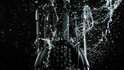 Mountain Bike Suspension Fork on Dark Background with Water Splash, Studio Shot