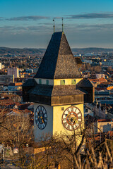 Aerial view of clock tower on Schlossberg and Graz city old town - 686392939