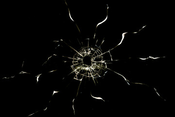 Broken glass from a bullet. Texture of broken glass. - obrazy, fototapety, plakaty