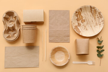 Disposable eco tableware on beige background
