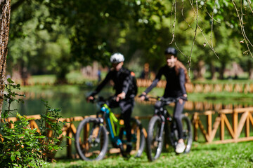 A blissful couple, adorned in professional cycling gear, enjoys a romantic bicycle ride through a park, surrounded by modern natural attractions, radiating love and happiness