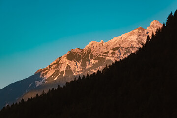 Alpine summer sunset or sundowner with alpenglow at Milders, Stubaital valley, Innsbruck, Austria