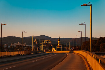 Sunset with a bridge and a church near Deggendorf, Danube, Bavaria, Germany