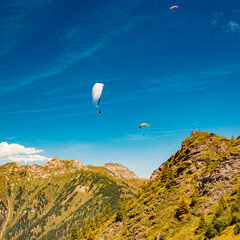 Alpine summer view with paragliders at Mount Fulseck, Dorfgastein, St. Johann im Pongau, Salzburg, Austria