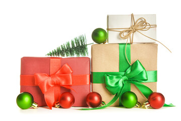 Gift boxes with bows, Christmas tree and balls on white background