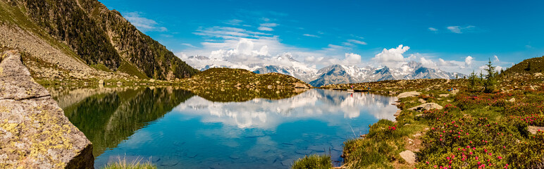 High resolution stitched alpine summer panorama with reflections at Lake Klaussee, Mount Klausberg,...