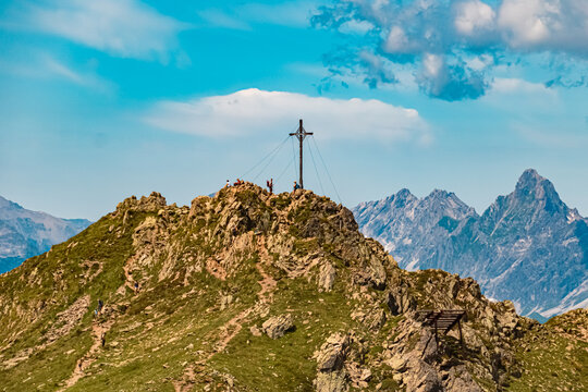 Alpine summer view with a summit cross at Mount Kreuzjoch, Schruns, Bludenz, Montafon, Vorarlberg, Austria