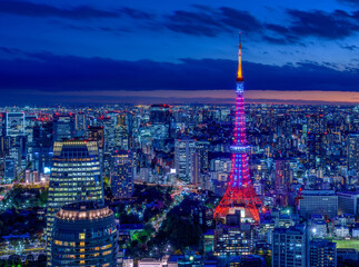 HDR image of Tokyo tower with Diamond Veil light up and Tokyo cityscape at magic hour. - obrazy, fototapety, plakaty