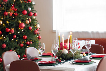 Festive table serving for Christmas celebration in dining room