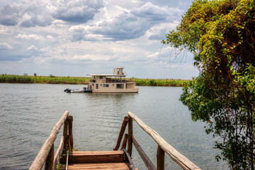 sailing with a motor  boat on Chobe river in Okavango delta , Botswana, tourist destinations